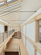 The supporting structure is made of wood except for the tie rods.