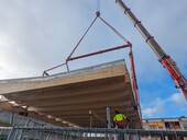 Installation of the panels, which are glued to the intermediate structure.