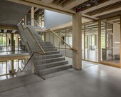 Vertical circulation core, mixed wood and concrete.